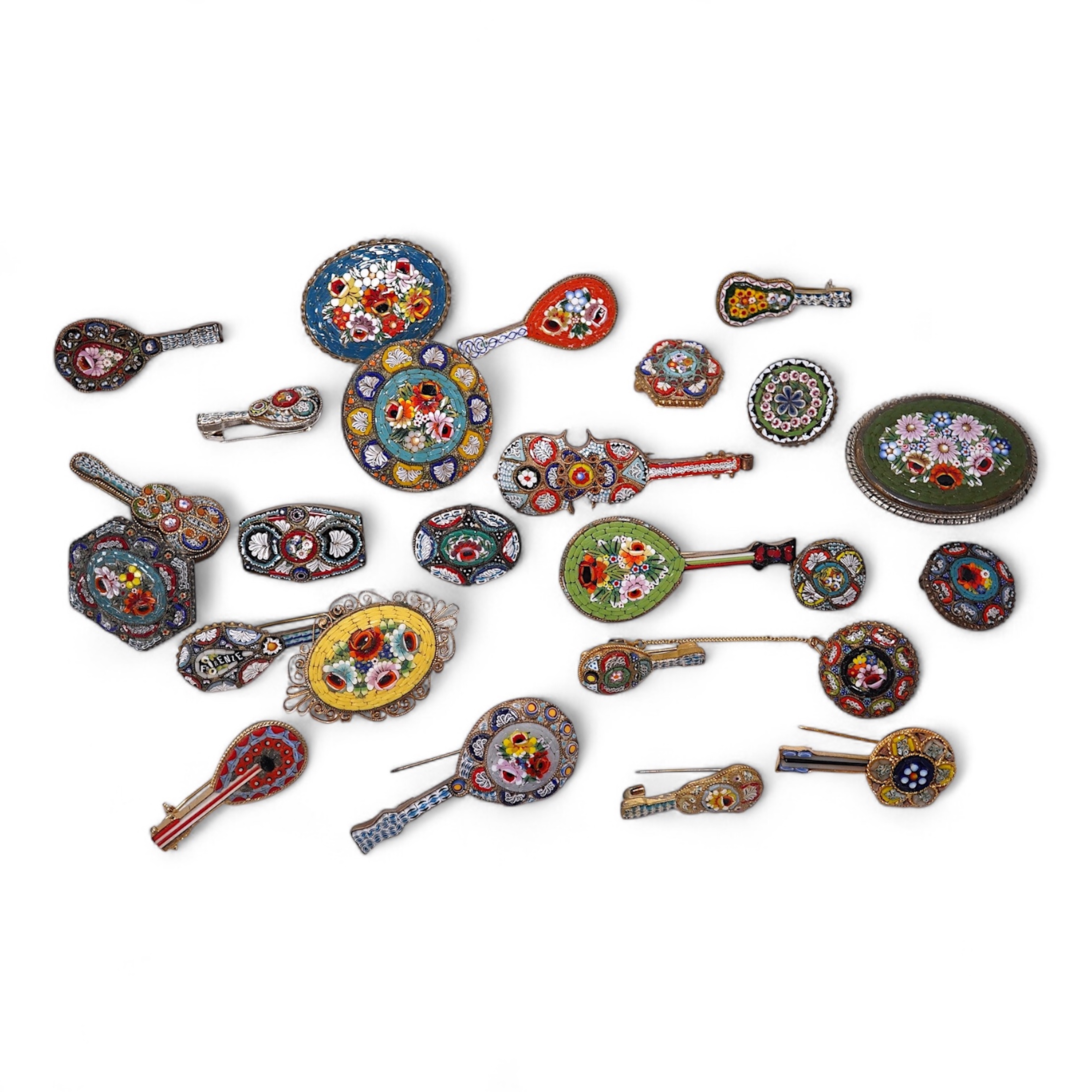 A collection of twenty-five micro-mosaic costume jewellery brooches. Including thirteen banjo and guitars shaped brooches, six large oval and circular brooches and six smaller brooches. Condition - mostly good